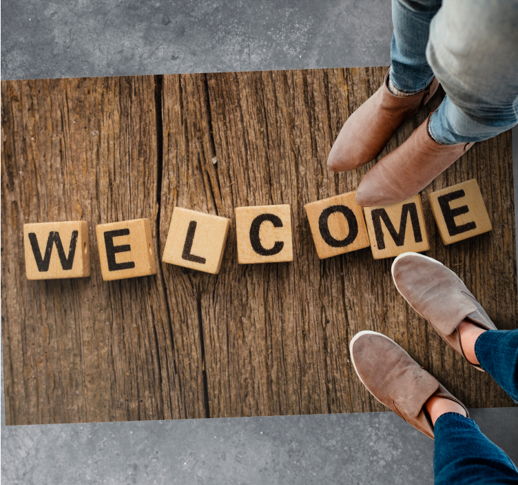 Alfombra vinílica frase bienvenida del alfabeto de madera - TenVinilo